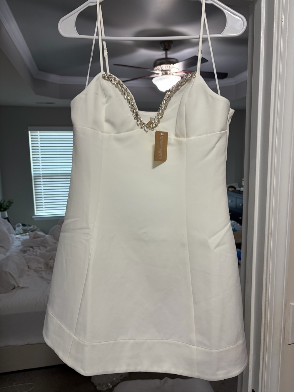 vestique Cream Mini Dress with Chain-Embellished Neckline